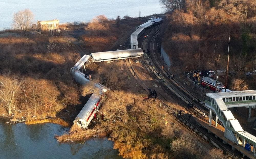 Cars from a Metro-North passenger train are scattered after the train derailed in the Bronx borough of New York, Sunday, Dec. 1, 2013. (Edwin Valero/AP)