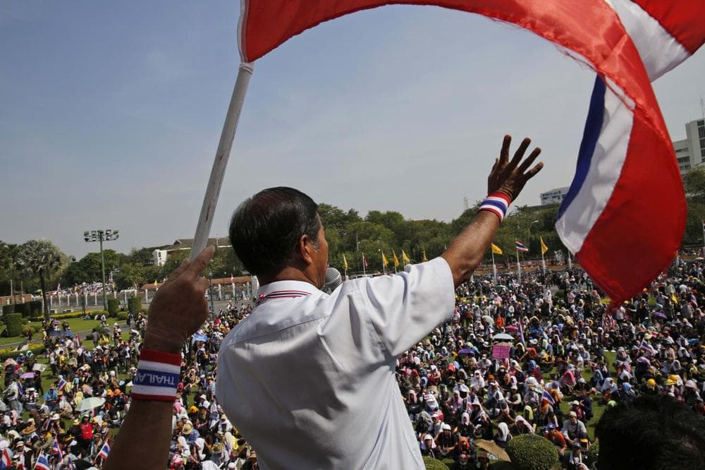 Anti-government protest leader Thaworn Seniam makes a speech on the lawn of Government House in Bangkok, Thailand, Tuesday, Dec. 3, 2013. (Manish Swarup/AP)