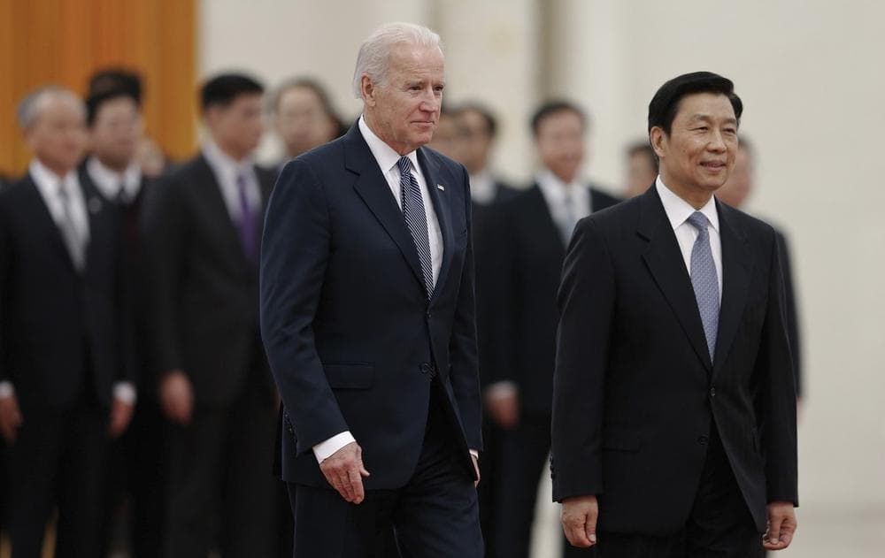 Chinese Vice President Li Yuanchao, right, and U.S. Vice President Joe Biden, left, review an honor guard during a welcome ceremony at the Great Hall of the People in Beijing, China, Wednesday, Dec. 4, 2013. (Lintao Zhang/AP)