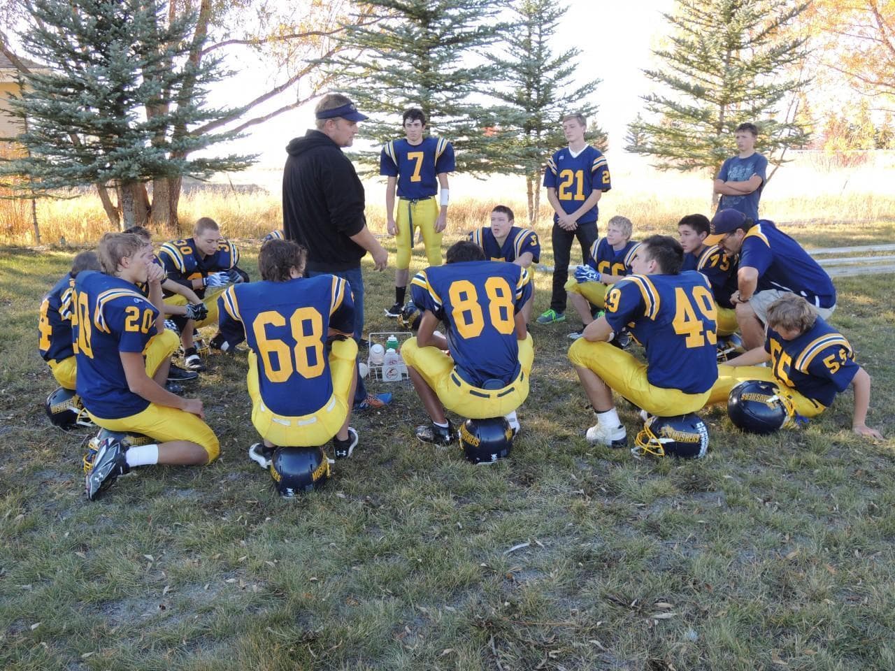 The team huddles are smaller than traditional football. (Scott Graf/Only A Game)