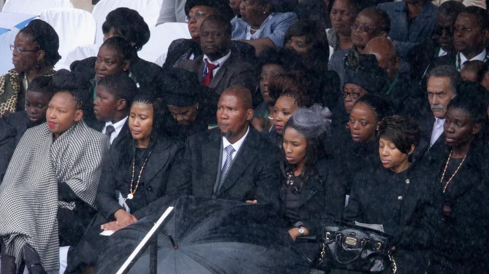 Members of the Mandela family, including grandson Mandla Mandela (C), attend the official memorial service for former South African President Nelson Mandela at FNB Stadium December 10, 2013 in Johannesburg, South Africa. (Photo by Chip Somodevilla/Getty Images)