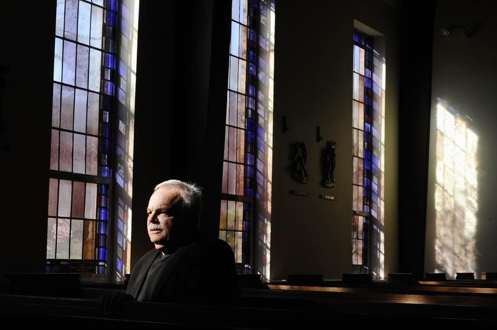 Monsignor Robert Weiss sits in a pew at St. Rose of Lima Roman Catholic Church in Newtown, Conn, Nov. 13, 2013. (Jessica Hill/AP)