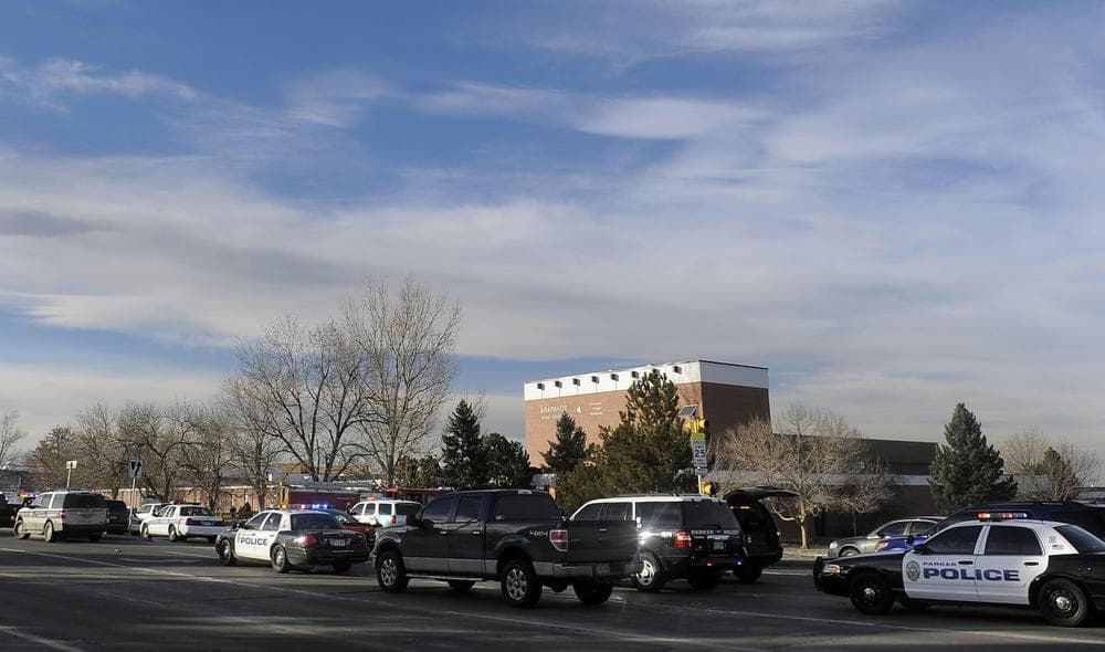 Emergency vehicles sit outside Arapahoe High School after a school shooting on December 13, 2013 in Centennial, Colorado. (Chris Schneider/Getty Images)