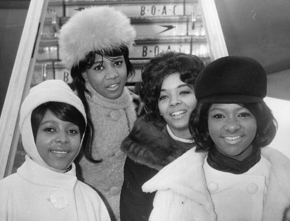 The Crystals, from left to right; Barbara, Dee Dee, Fran and La La, at London Airport for their first visit to the country, Feb. 7, 1964, hot on the heels of their successful singles 'Then He Kissed Me' and 'Da Doo Ron Ron.' (Keystone/Getty Images)