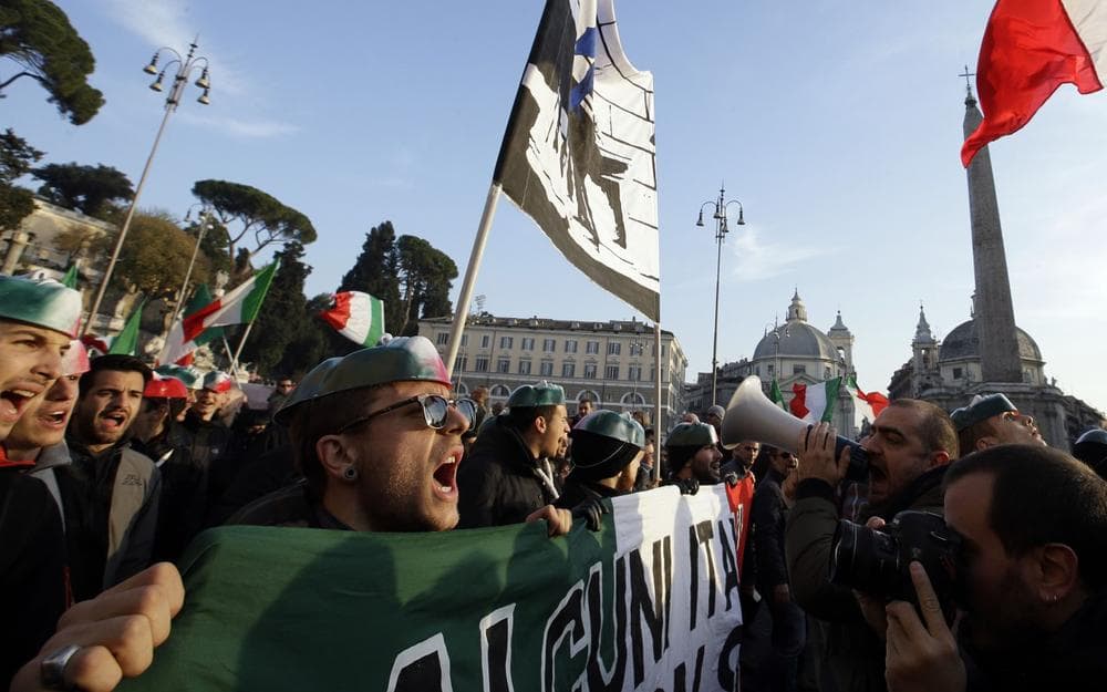 Demonstrators gather in Piazza del Popolo square to protest against the government's austerity measures in Rome, Dec. 18, 2013. (Gregorio Borgia/AP)