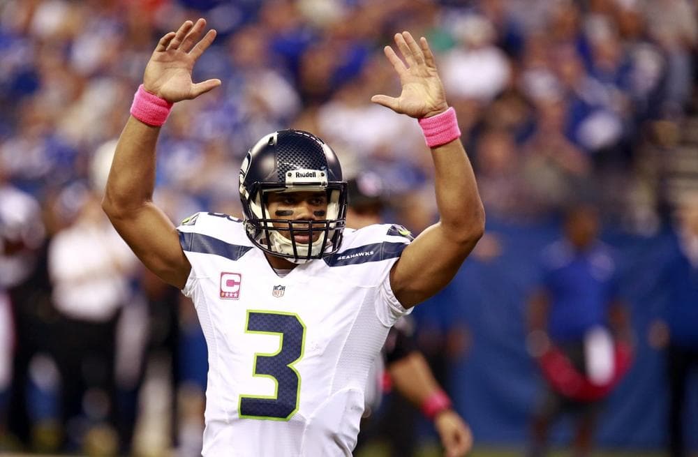 Russell Wilson and the Seattle Seahawks have had much to celebrate in 2013. (Brent R. Smith/AP)