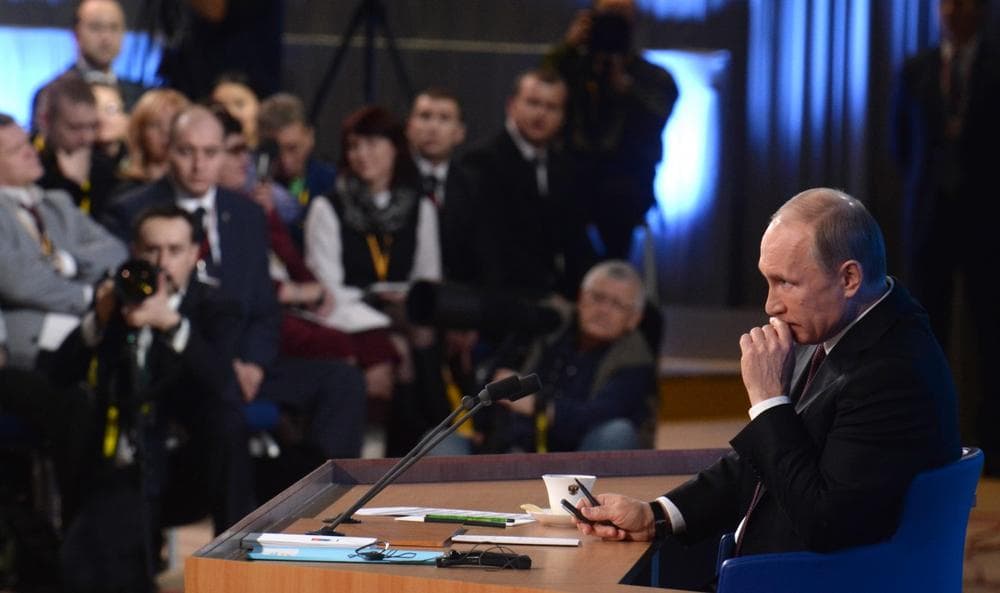 Russia's President Vladimir Putin listens to a question during his annual press conference in Moscow on December 19, 2013. (Vasily Maximov/AFP/Getty Images)