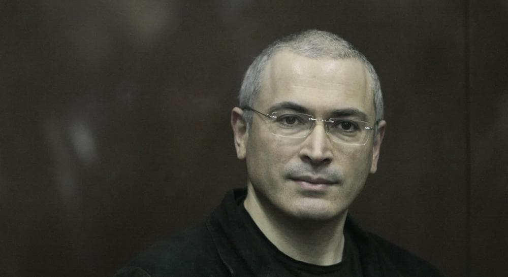 In this Thursday Dec. 30, 2010 file photo Mikhail Khodorkovsky looks from behind a glass enclosure in a court room in Moscow, Russia. Khodorkovsky, the archrival of President Vladimir Putin, has been released from prison after a decade behind bars, his spokeswoman told the Associated Press on Friday. Khodorkovsky spent 10 years in prison on politically tinted charges of tax evasion and embezzlement. (Alexander Zemlianichenko Jr./AP)