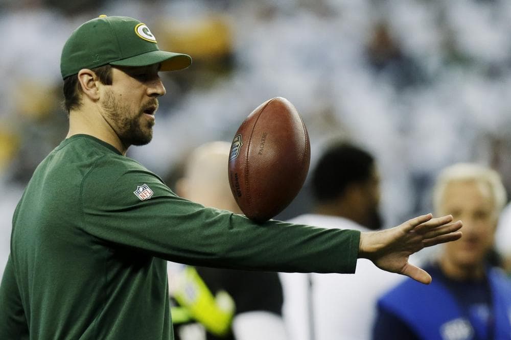 For now, Green Bay QB Aaron Rodgers is going to be limited to doing tricks on the sidelines. (AP/Tim Sharp)