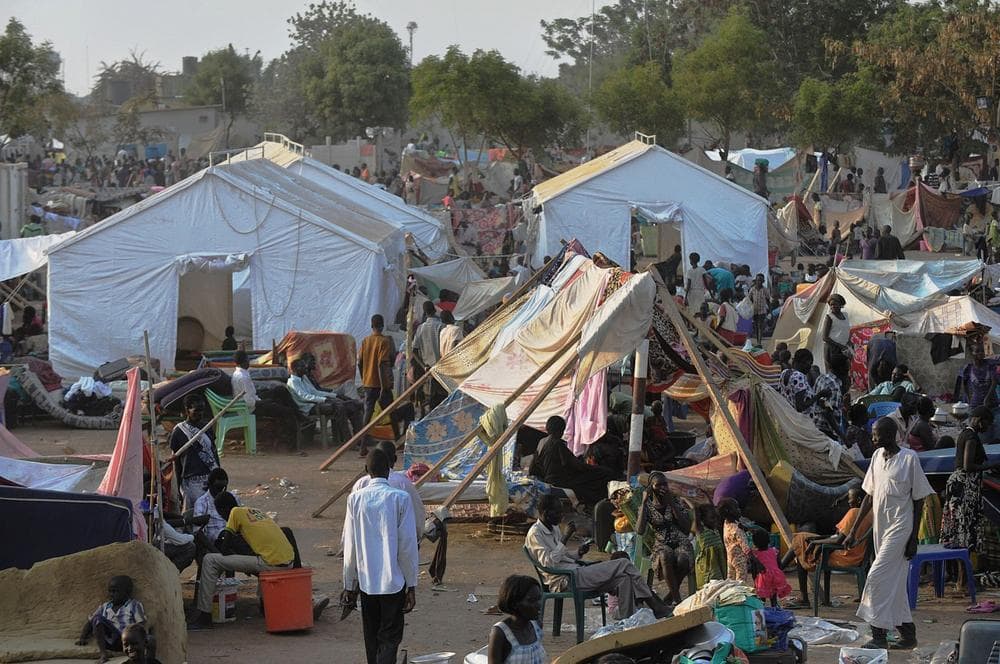 People gather at a makeshift IDP camp at the United Nations Mission in South Sudan (UNMISS) compound in Juba on December 22, 2013 where South Sudanese continue to flock as fears of a resumption of fighting in the capital fester. (Tony Karumba/AFP/Getty Images)