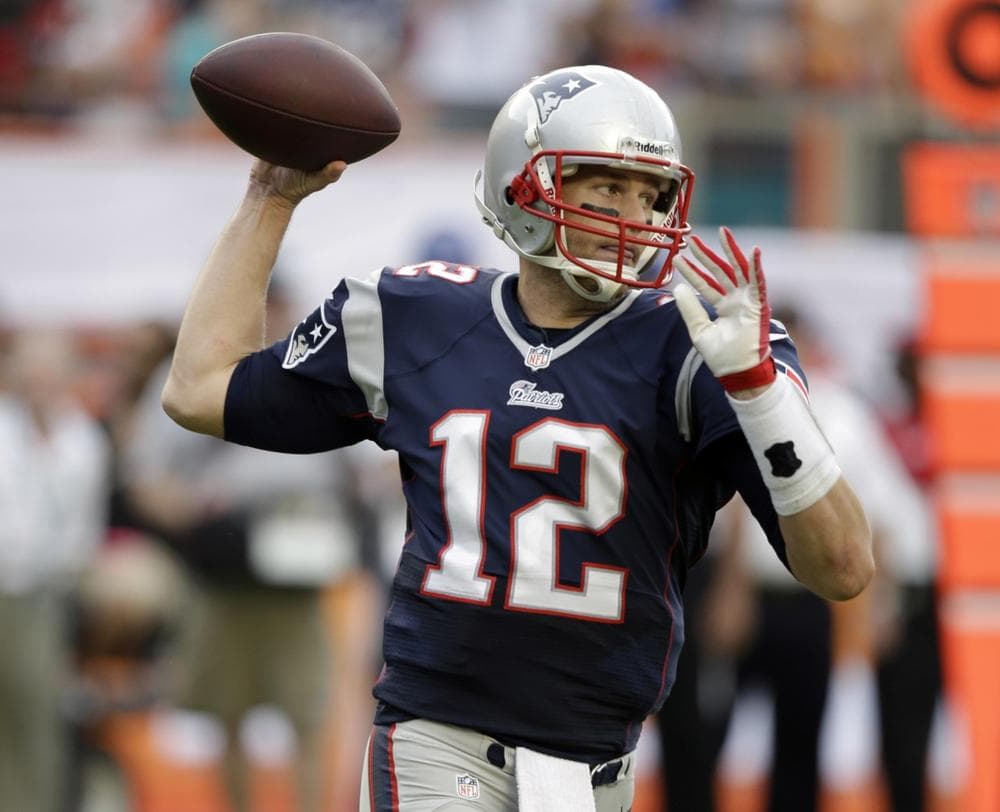 New England Patriots quarterback Tom Brady (12) throws the ball during the second half of an NFL football game against the Miami Dolphins, Sunday, Dec. 15, 2013, in Miami Gardens, Fla. (AP Photo/Lynne Sladky)