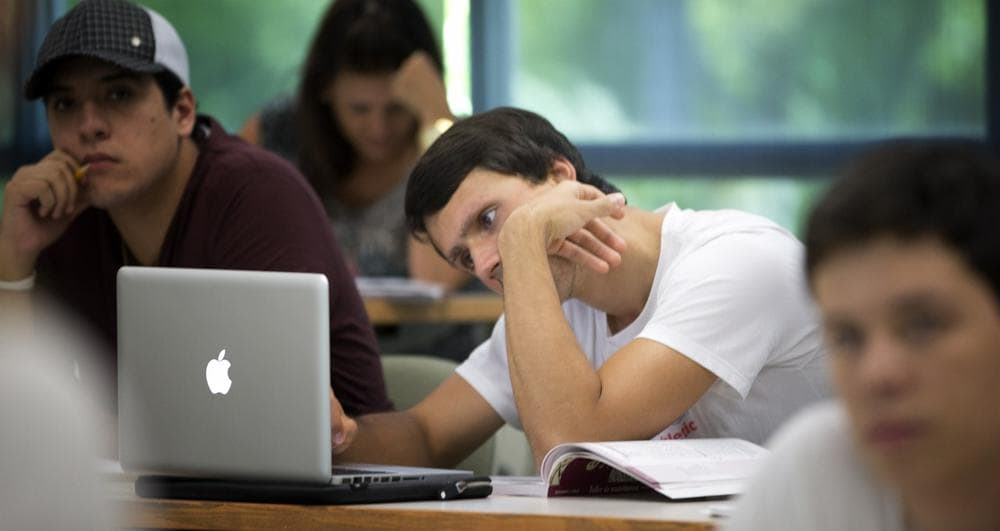 More college admissions officers are looking at more than resumes and Googling applicants. (J Pat Carter/AP)