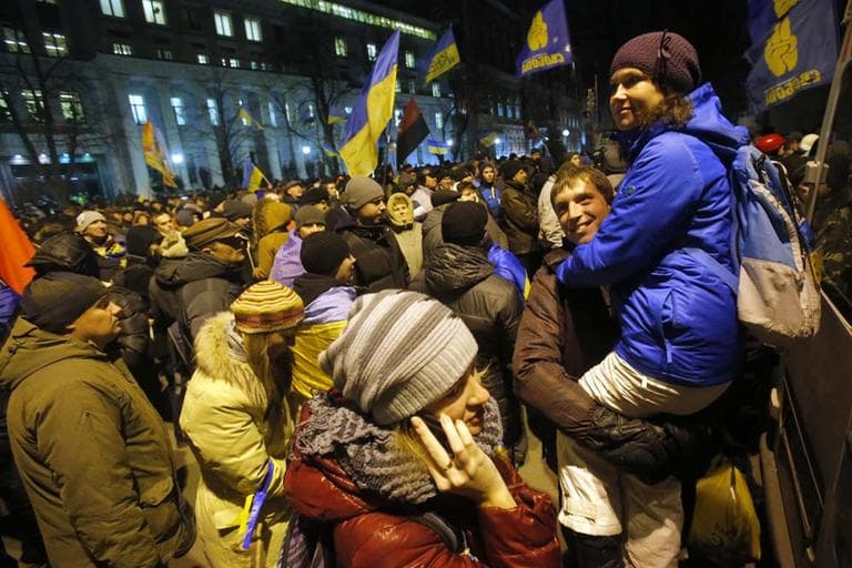 People rally outside of the presidential administration building in downtown Kiev, Ukraine, on Tuesday, Dec. 3, 2013. Ukraine's opposition failed to force out the government with a parliamentary no-confidence vote Tuesday, leaving political tensions unresolved and a potential standoff between protesters and the country's leaders looming. (AP)