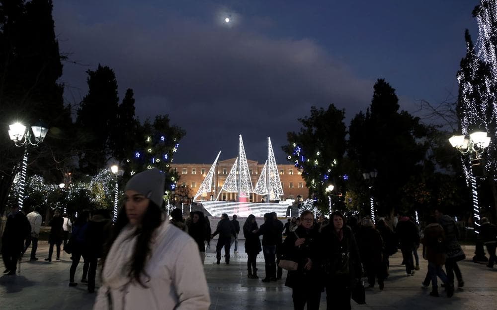 An illuminated boat—an old Greek symbol—decorates Athens' Syntagma Square in front of the Greek parliament on Dec. 13, 2013. (AP Photo/Petros Giannakouris)