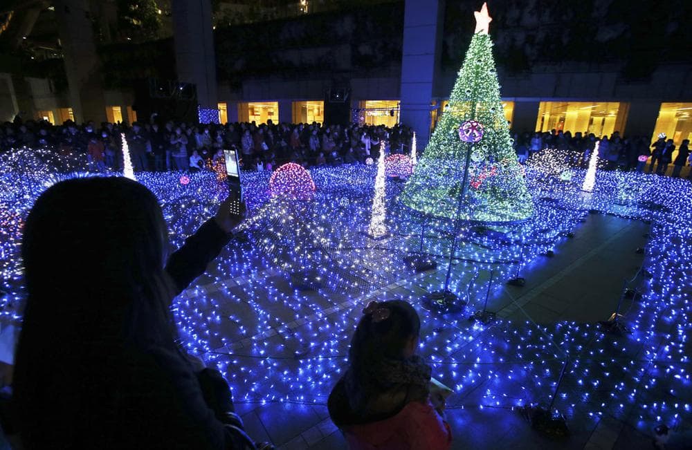 People gather to watch Christmas Illuminations in Tokyo, Japan, on Dec. 7, 2013. (AP Photo/Koji Sasahara)