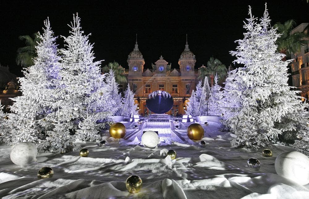 Snow white trees decorate the front of the Monte Carlo Casino in Monaco for Christmas and New Year's on Dec. 11, 2013. (AP Photo/Lionel Cironneau)