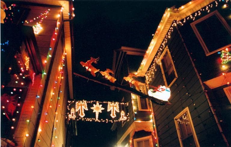 Reindeer pull Santa's sleigh over John Ragno’s Otis Street driveway. (Somerville Arts Council)