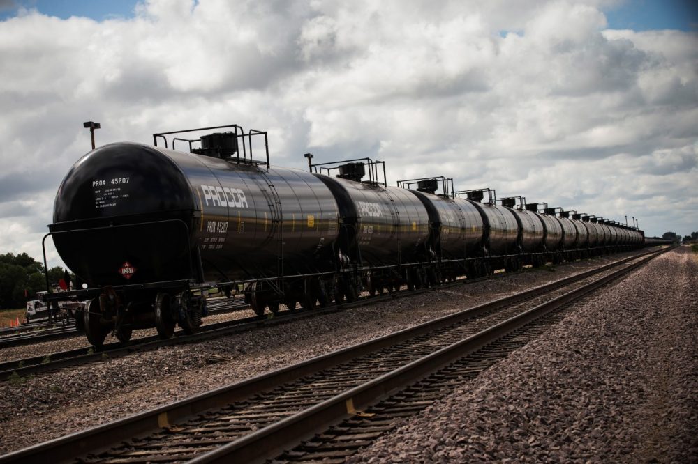 Oil containers sit at a train depot on July 26, 2013 outside Williston, North Dakota. Concerns have been raised that the oil extracted from the Bakken Shale in North Dakota is more hazardous than conventional crude oil. (Andrew Burton/Getty Images)