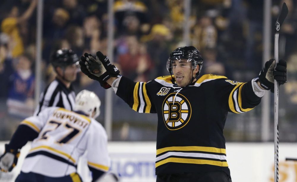 Boston Bruins left wing Brad Marchand sticks out his tongue as he celebrates his goal during overtime against the Nashville Predators. (Charles Krupa/AP)
