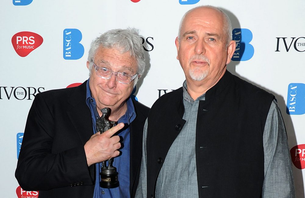 Randy Newman wins the Novello Award for 'PRS for Music Special International Award' presented by Peter Gabriel at the Grosvenor House in London on Thursday, May 16, 2013. (Mark Allan/Invision via AP)