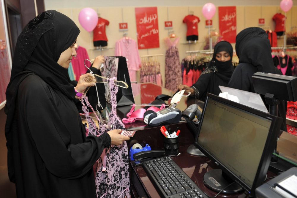 Fully-veiled Saudi women shop at a lingerie store in the Saudi Red Sea port of Jeddah on January 2, 2012. From this week, only female staff will be able to sell women's lingerie in Saudi Arabia, ending decades of awkwardness in the ultra-conservative Muslim kingdom where women are expected to don black cloaks at all times out of the home. (Amer Hilabi/AFP/Getty Images)