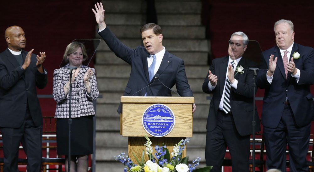 Boston Mayor Marty Walsh waves after giving his inaugural address in Conte Forum at Boston College in Boston, Monday, Jan. 6, 2014. (Michael Dwyer/AP)