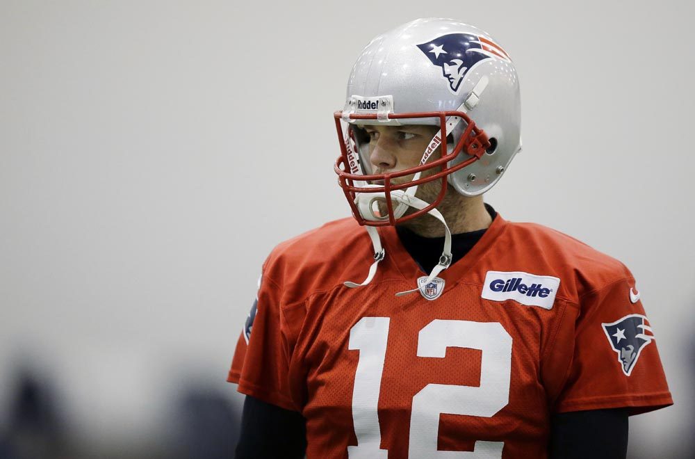 Tom Brady pauses during practice in Foxborough Tuesday (Stephan Savoia/AP)