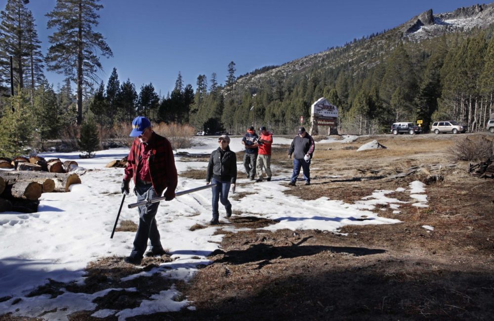 Frank Gehrke, chief of snow surveys for the California Department of Water Resources, left, leads his group out to measure snow levels near Echo Summit, Calif., on Friday, Jan. 3, 2014. (Steve Yeater/AP)