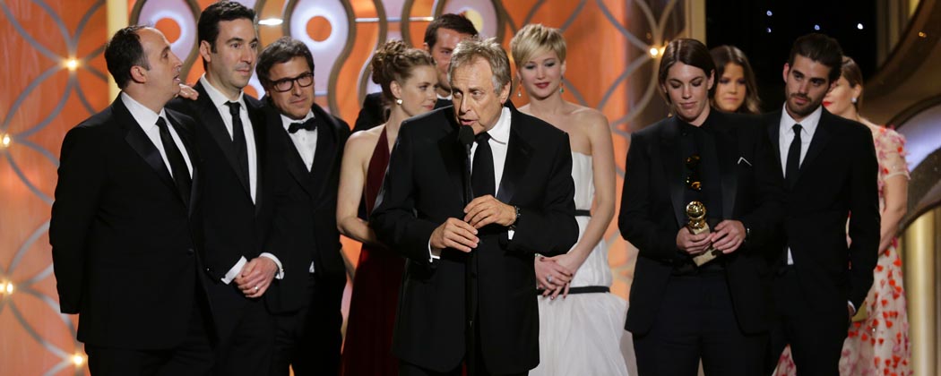 Charles Roven, center, accepts the award for best motion picture comedy for &quot;American Hustle.&quot; (Paul Drinkwater/NBC/AP)