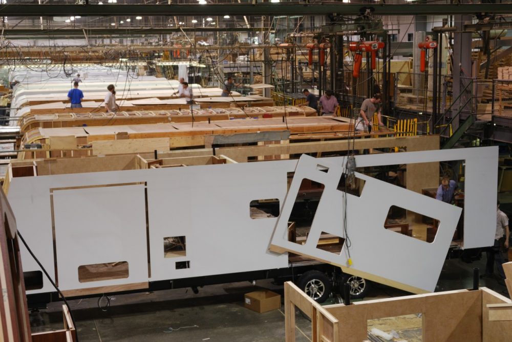 Workers at the Jayco factory in Elkhart, Indiana, assemble a recreation vehicle (RV) on a fast-moving assembly line on March 15, 2011. Once idle factories are ringing again with the welcome sounds of motor homes being built. Elkhart is known as the RV capital of the world and more than half the jobs in the area are in manufacturing -- four times the national average. (Mira Oberman/AFP/Getty Images)