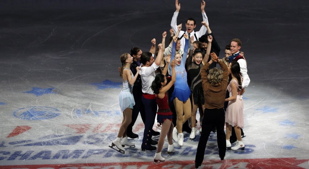 The U.S. Olympic figure skating team headed to Sochi do a group cheer on mid-ice at the end of their skating spectacular after the U.S. Figure Skating Championships in Boston, Sunday, Jan. 12, 2014. (Elise Amendola/AP)