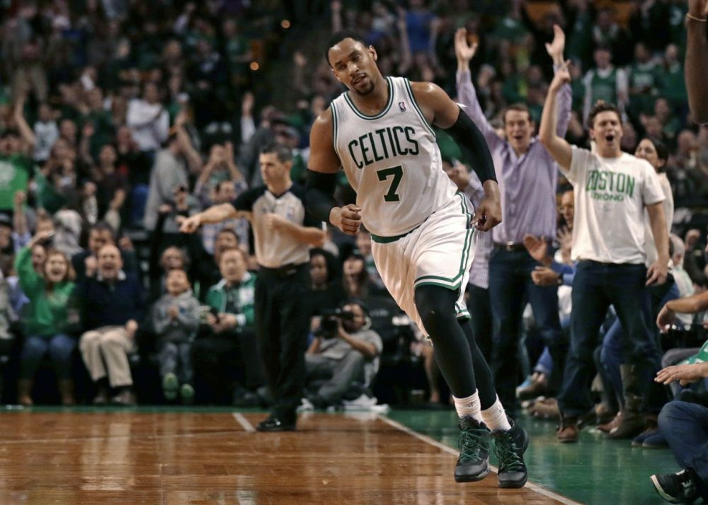 Fans cheer as Boston Celtics forward Jared Sullinger heads upcourt after hitting a basket with time expiring in the third quarter. (AP/Charles Krupa)
