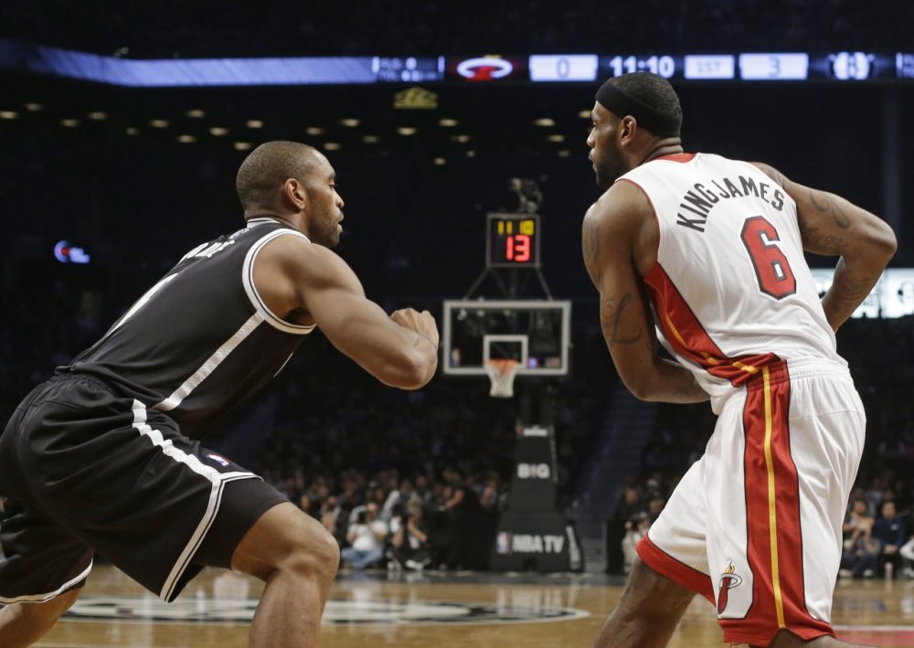 The Heat and Spurs debuted nickname jerseys.  Here LeBron &quot;King James&quot; James faces off against Alan &quot;Double&quot; Anderson. (Frank Franklin II/AP)