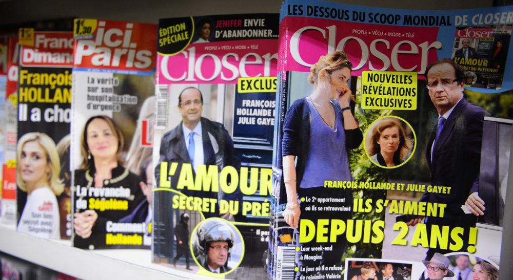 Celebrity news magazines are on display at a Paris newstand, Friday, Jan. 17, 2014. (Zacharie Scheurer/AP)