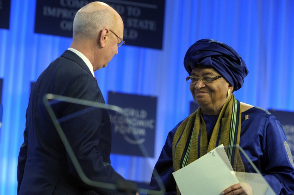 WEF Executive Chairman Klaus Schwab shakes hands with Liberia's President Ellen Johnson-Sirleaf prior to her speech during the World Economic Forum in Davos on January 22, 2014. (Eric Piermont/AFP/Getty Images)