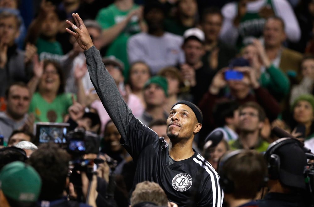 Former Celtics great and current Brooklyn Nets forward Paul Pierce waves to the crowd during a tribute to him Sunday night in Boston. (Steven Senne/AP)
