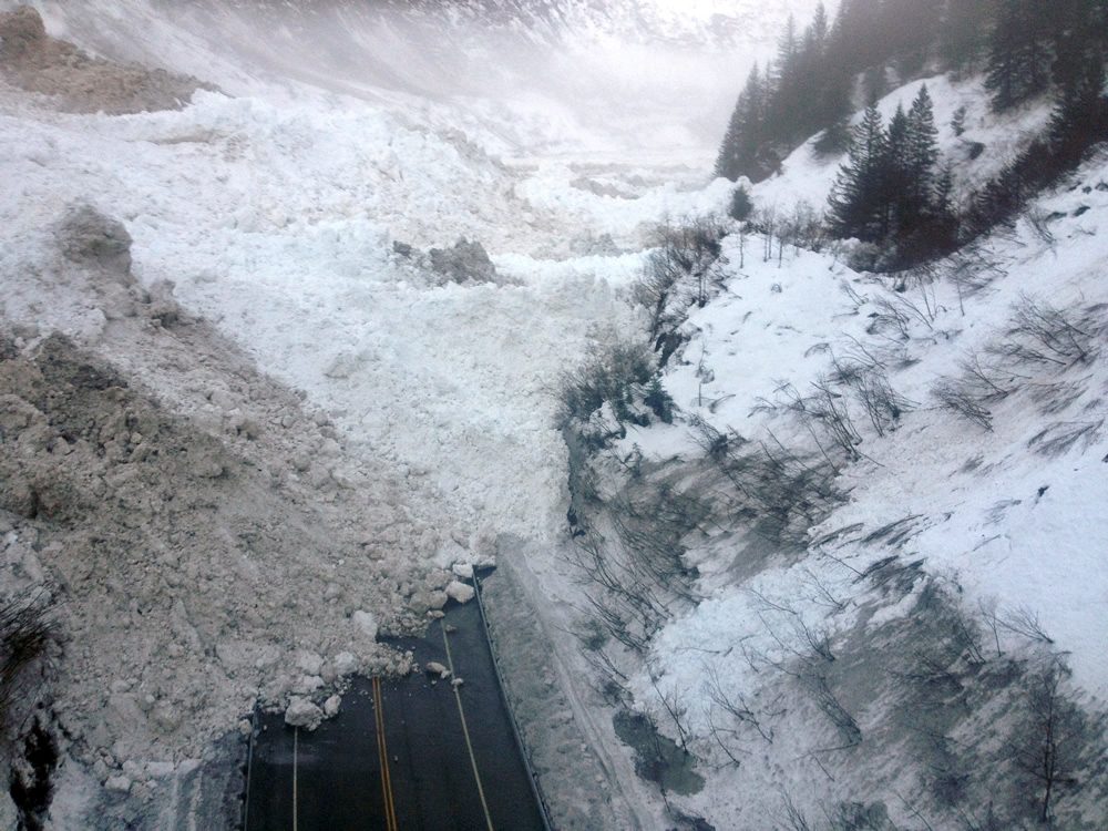 This Jan. 24, 2014 photo shows multiple avalanches that crossed the Richardson Highway in the Thompson Pass region of Valdez, Alaska. (Alaska Department of Transportation &amp; Public Facilities via AP)