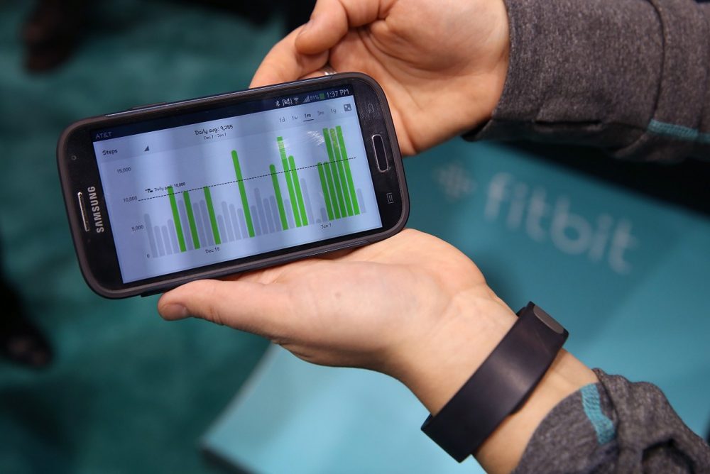 Data collected from the Fitbit Force is displayed on a smartphone in the Fitbit booth at the 2014 International CES at the Las Vegas Convention Center on January 7, 2014 in Las Vegas, Nevada. (Justin Sullivan/Getty Images)