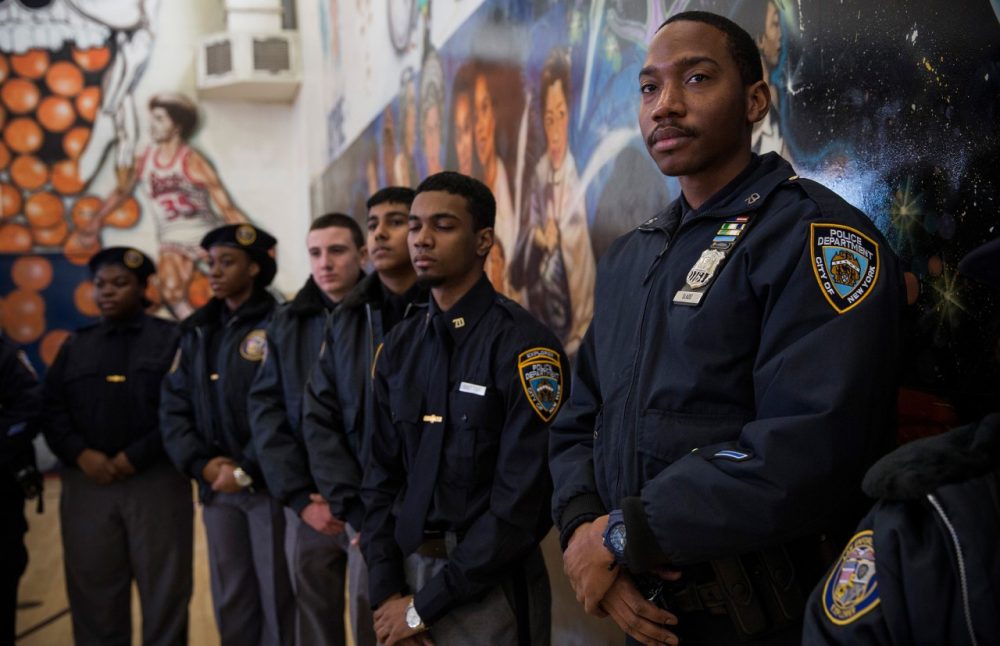 New York City Police Department Explorers attend a press conference held by Mayor Bill DeBlasio announcing the city will not appeal a judge's ruling that the police tactic 'Stop-and-Frisk' is unconstitutional, which the judge had ruled over last summer, on January 30, 2014 in in the Brownsville neighborhood of the Brooklyn borough of New York City. (Andrew Burton/Getty Images)