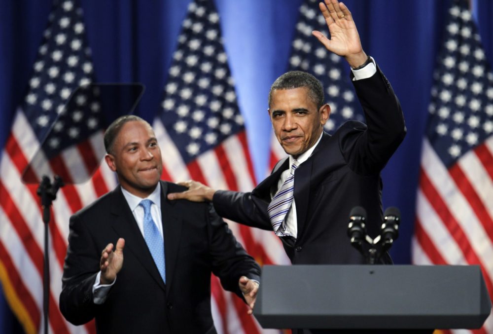 President Barack Obama, right, waves while Massachusetts Gov. Deval Patrick, left, applauds as Obama takes the stage during a campaign fundraising event, in Boston, Wednesday, May 18, 2011. Patrick introduced Obama at the event. (AP)