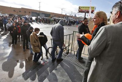 Store owner Toni Fox, second from right, greets customers standing in a snaking line numbering several hundred people shortly after the opening of her 3D Cannabis Center in Denver at 8am on Wednesday Jan. 1, 2014. Colorado began legalized retail recreational marijuana sales on Jan. 1, a day some are calling &quot;Green Wednesday.&quot; (AP)
