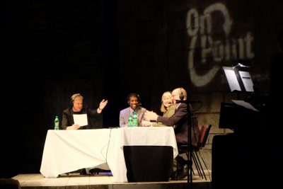 Host Tom Ashbrook joins Jarvis Deberry, Denise Reed and Tommy Michot on the stage of Le Petit Theatre in New Orleans for On Point Live! on Thursday, Jan. 24. (Janet  Watson / WWNO)