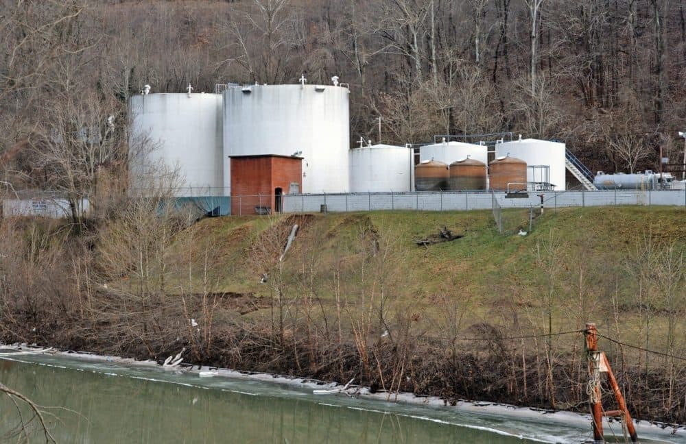 Freedom Industries is pictured on the banks of the Elk River, January 10, 2014, in Charleston, West Virginia. West Virginia American Water determined MCHM chemical had 'overwhelmed' the plant's capacity to keep it out of the water from a spill at Freedom Industries in Charleston. An unknown amount of the hazardous chemical contaminated the public water system for potentially 300,000 people in West Virginia. (Tom Hindman/Getty Images)