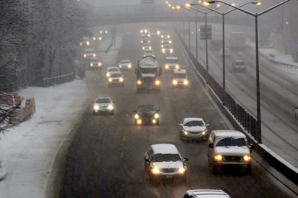 Cars travel down a highway during a snowstorm in the Brooklyn borough on February 3, 2014 in New York City. (Spencer Platt/Getty Images)