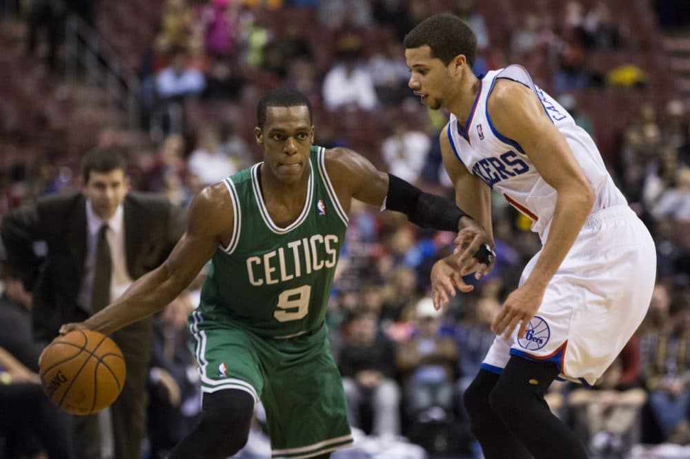 Boston Celtics' Rajon Rondo, left, looks to make his move on Philadelphia 76ers' Michael Carter-Williams. (AP/Chris Szagola)