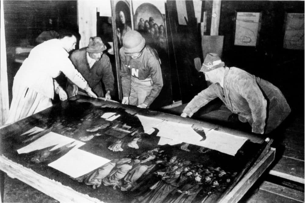 Monuments Man George Stout moves the central panel of the Ghent Altarpiece in Altaussee, Austria in July of 1945. (National Archives and Records Administration/AP)