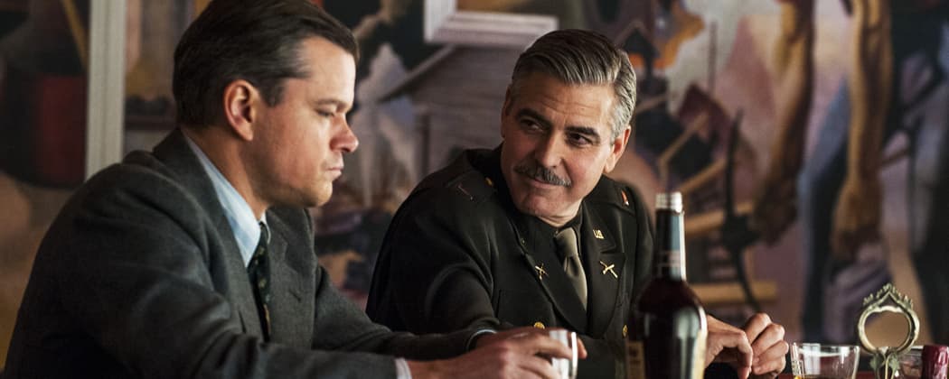 This film image released by Columbia Pictures shows Matt Damon, left, and George Clooney in &quot;The Monuments Men.&quot; A spokesman for Sony Pictures said Wednesday, Oct. 23, 2013, that the film will now be released in the first quarter of next year, instead of its planned release date of Dec. 18. “Monuments Men,” which Clooney directed, co-wrote and stars in, had been expected to be a top Oscar contender. (Claudette Barius/Sony/AP Photo/Columbia Pictures)