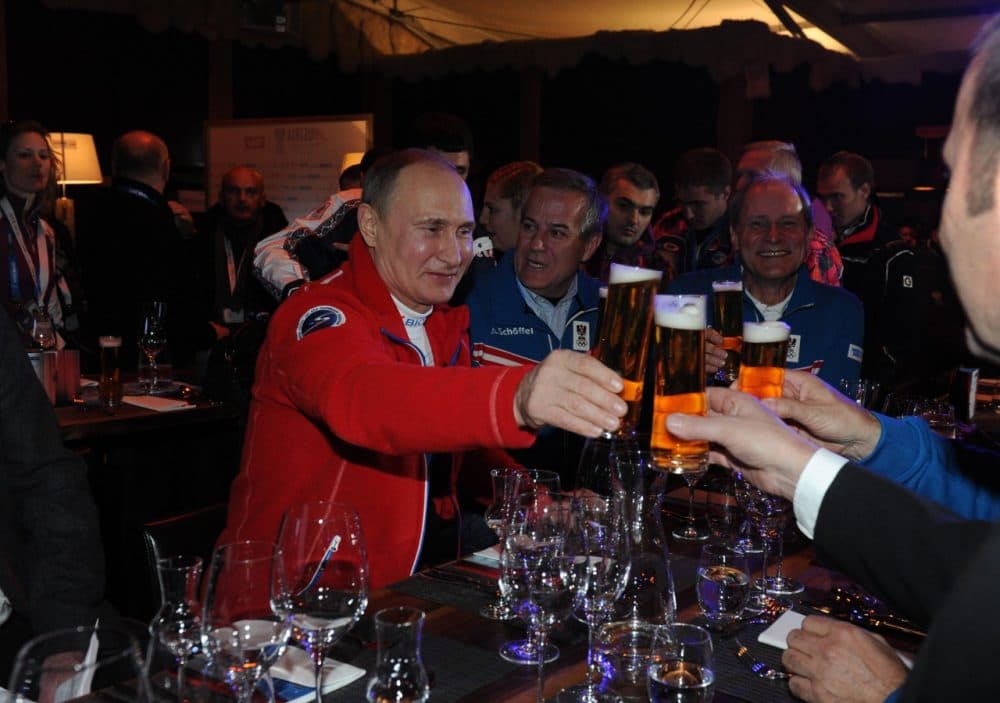 Russian President Vladimir Putin hasn't had trouble finding a beer in Sochi. Spectators haven't been so lucky. (Mikhail Klimentyev/AFP/Getty Images)