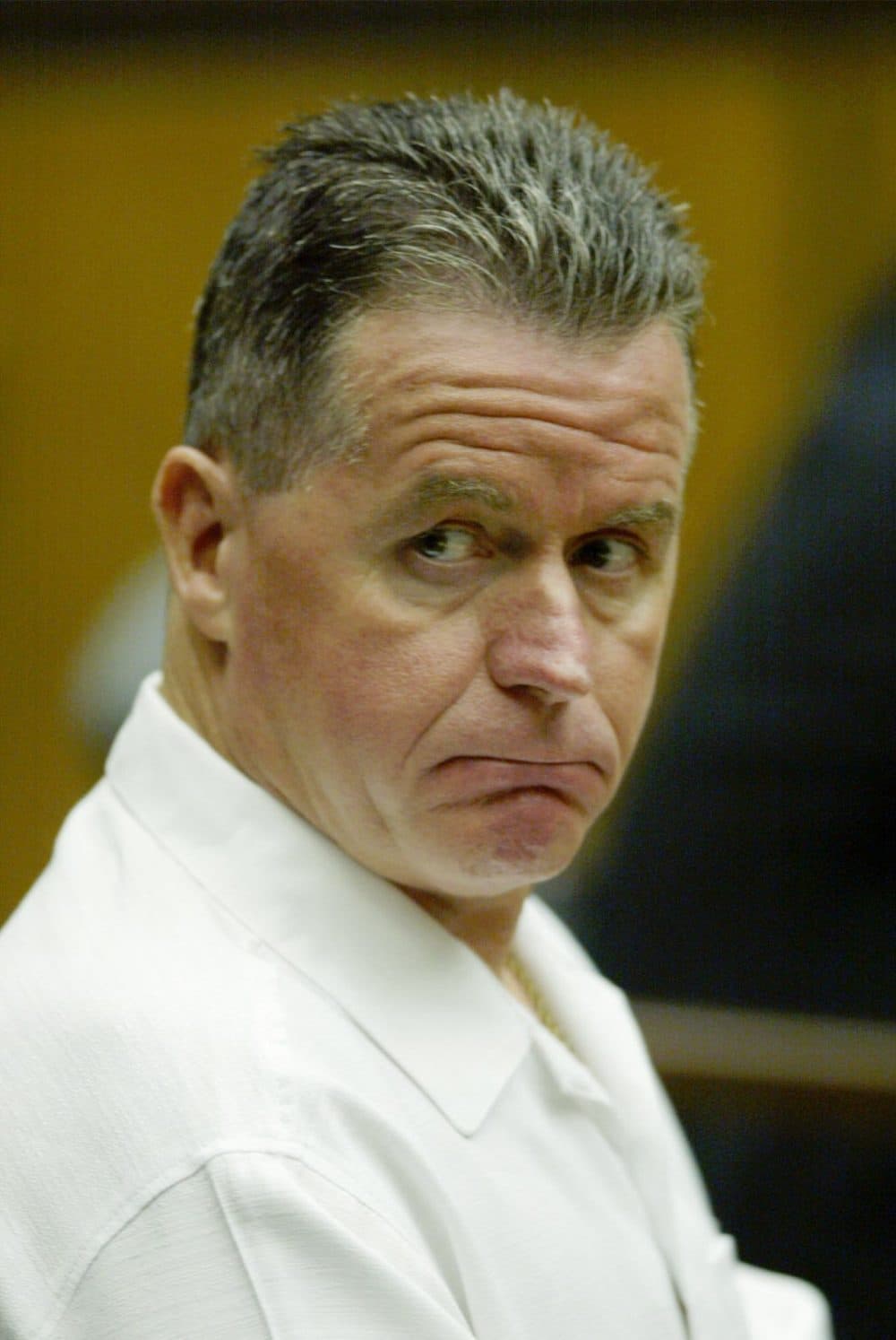 In this AP file photo, Fred Weichel, then 50, sits in court in 2003. He is serving a life sentence for a 1980 murder. (Julia Malakie/AP)