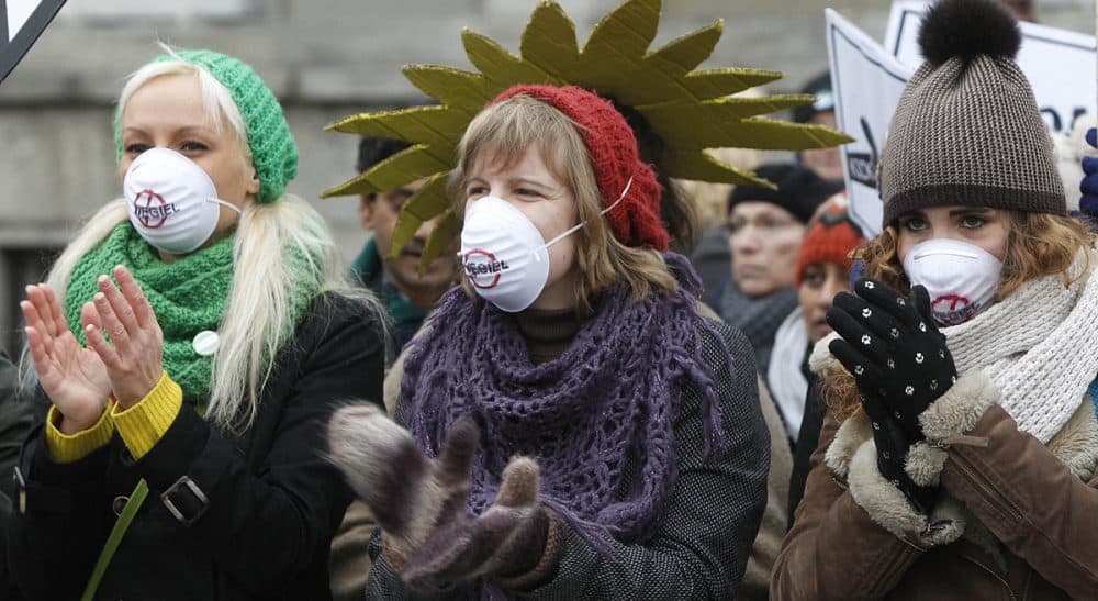 Passionate pursuit of our beliefs feels great, but can blind us to common sense. It happens to environmentalists on the left as much as to climate deniers on the right. In this photo, demonstrators protest a coal industry meeting in front of the Polish Ministry of Economy in Warsaw, Monday Nov. 18, 2013. (Czarek Sokolowski/AP)